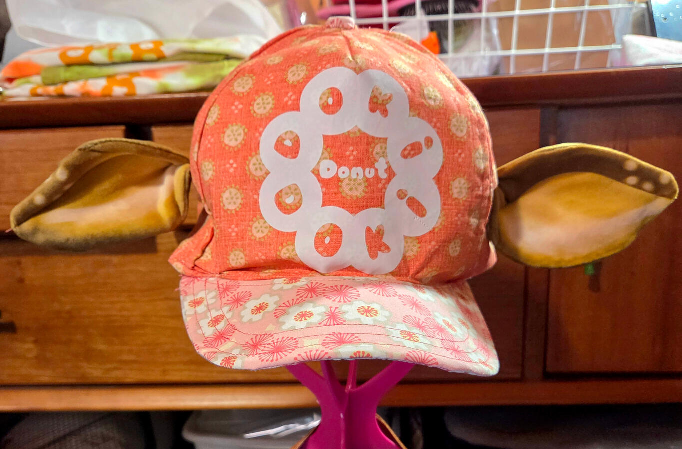 Eared Trucker-Style Ballcap; patterned, sewn and designed in-house. DTF film outsourced for printing only. Original Design for a self-created fictional Store. FRONT